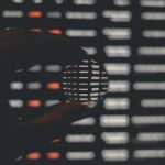 person holding black and white round ornament