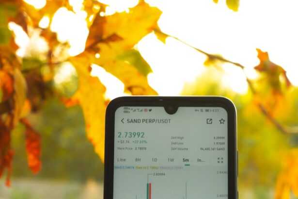 a person holding a cell phone in their hand