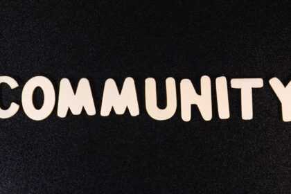 the word community written in white on a black background