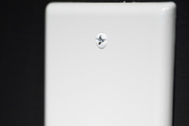 a person is holding a blue toothbrush in their hand