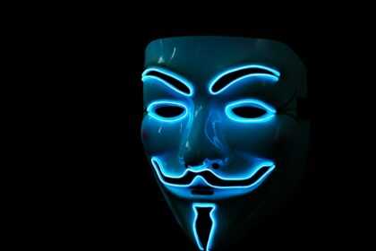 a person wearing a blue mask with a black background