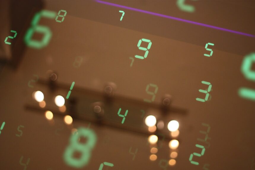Numbers are reflected on a surface, blurring the image.