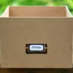 black and silver usb flash drive in brown box