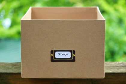 black and silver usb flash drive in brown box