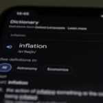 a close up of a cell phone with information on the screen