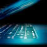 closeup photo of turned-on blue and white laptop computer