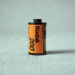 a can of kodak on a white surface