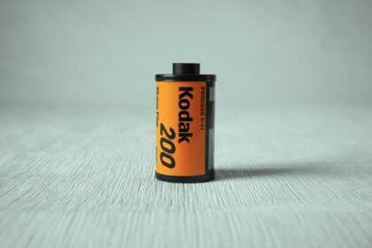 a can of kodak on a white surface