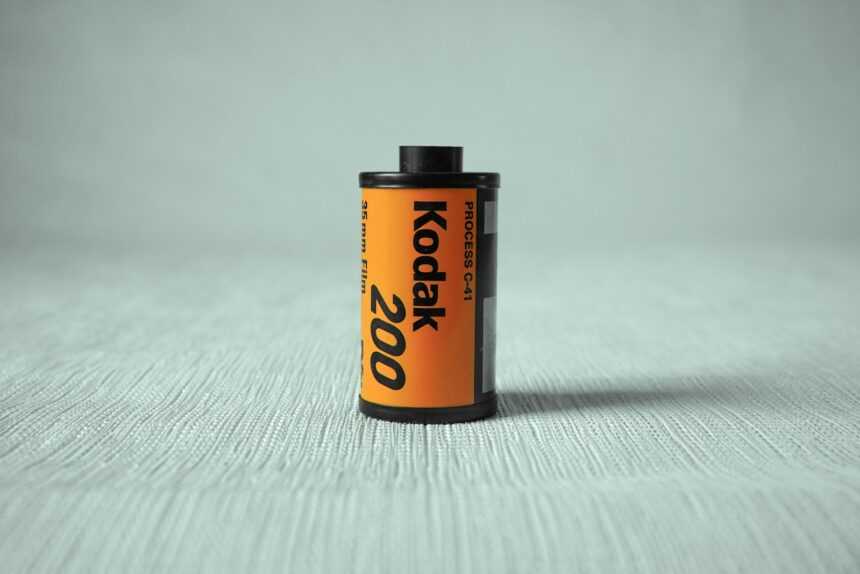 a can of kodak on a white surface