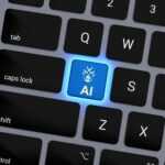 a computer keyboard with a blue light on it