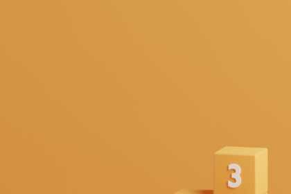 a block tower with the letters b e w on it