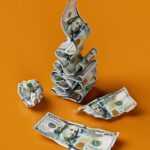 a stack of money sitting on top of a table