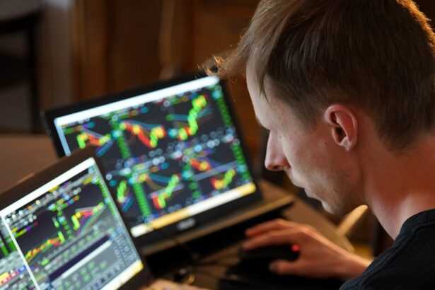 man sitting in front of the laptop