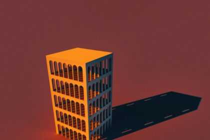 a tall yellow building sitting on top of a red floor