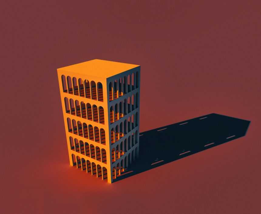 a tall yellow building sitting on top of a red floor