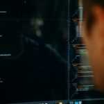 person facing computer desktop