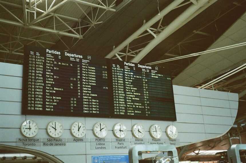 a sign with a number of clocks