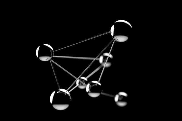 a black and white photo of a network of spheres