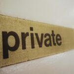 a wooden sign that says private on it