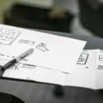 black marker on white printer papers
