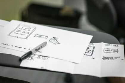 black marker on white printer papers