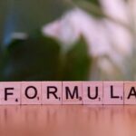 A close up of a scrabble type word on a table