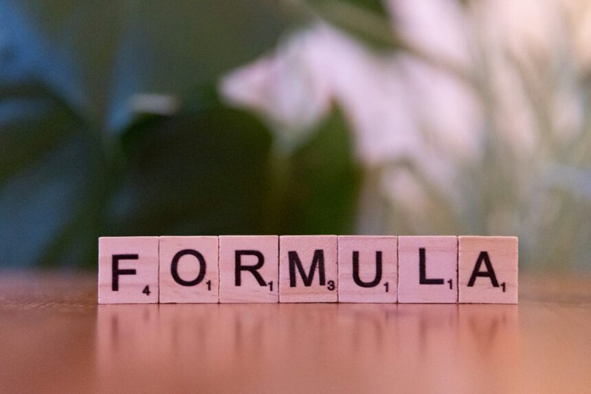 A close up of a scrabble type word on a table