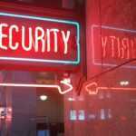 a red security sign and a blue security sign