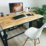 macbook pro on brown wooden table