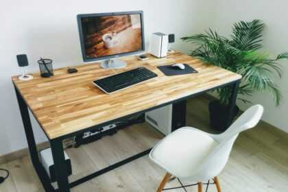 macbook pro on brown wooden table