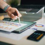 a person is writing on a piece of paper